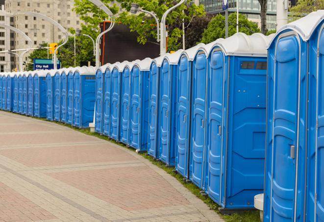 a row of portable restrooms set up for a large athletic event, allowing participants and spectators to easily take care of their needs in Allentown, PA